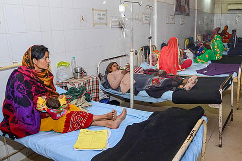 Sick children in the laps of their mothers take treatments at the JK Lon hospital where at least 100 infants have died in the month of December as per reports in Kota district Friday Jan. 3 2020. (Photo | PTI)