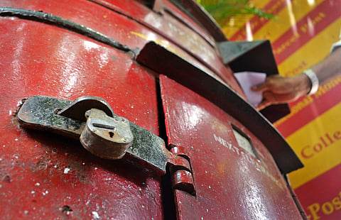 Postal dept bags found on plot, drunk man burns most of them