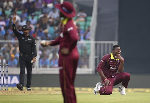 West Indies' Oshane Thomas, right, reacts as umpire Anil Chaudhary, left, signals a free-hit during the fifth and last one-day international cricket match between India and West Indies in Thiruvananthapuram, India, Thursday, Nov. 1, 2018. | AP
