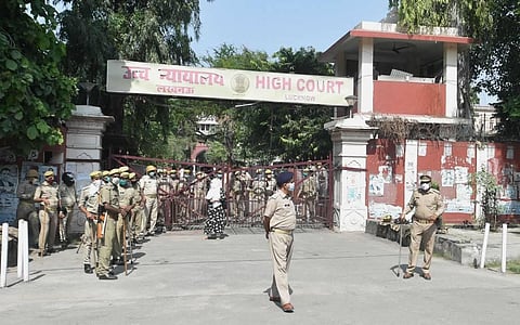 Police stand guard outside a special CBI court during pronouncement of its judgement of those accused in 1992 Babri mosque demolition case in Lucknow Wednesday Sept. 30 2020. (Photo | PTI)