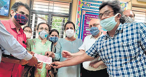 AIPA prez Ashok Agarwal & association member Teena Sharma at school. (Photo| EPS)