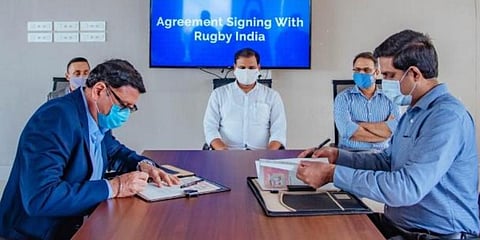 Sports Director R Vineel Krishna and president of IRFU Maneck Unwala signing the agreement on Tuesday. (Photo | EPS)