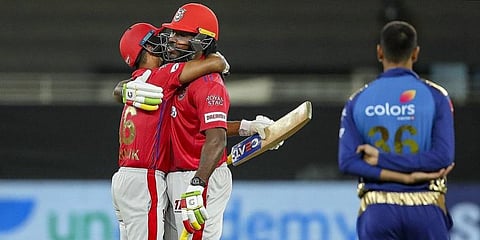 Kings XI Punjab players Mayank Agarwal and Chris Gayle celebrate after winning their Indian Premier League T20 match against Mumbai Indians. (Photo | PTI)