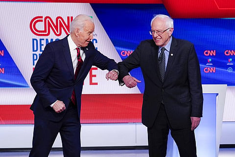 Democratic presidential candidate and US President Joe Biden with Bernie Sanders