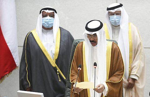 The new Emir of Kuwait Sheikh Nawaf Al Ahmad Al Sabah, middle, recites the constitutional oath at the Kuwaiti National Assembly. (Photo | AP)