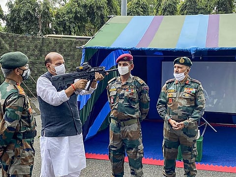 Defence Minister Rajnath Singh inspects weapons at the Sukna Army Camp in Darjeeling. (Photo | Twitter)