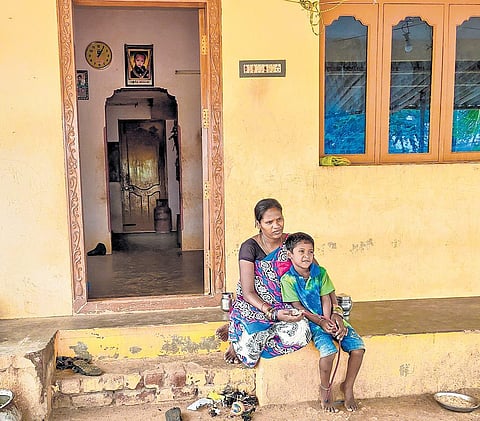 the borewell that took Sujith’s life is now filled with concrete; his mother Kalamary and brother Punith in front of their house | Jayakumar Madala