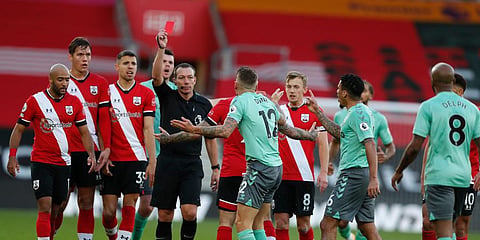 Everton's Lucas Digne (C)Â is shown a red card by the referee after a foul on Southampton's Kyle Walker-Peters during an EPLÂ match at the St. Mary's Stadium. (Photo | AP)