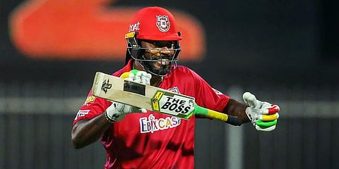 Chris Gayle of Kings XI Punjab after scoring fifty runs during IPL match against Kolkata Knight Riders in Sharjah. (Photo | PTI)