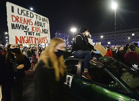 Angered protesters block rush-hour traffic on the 5th day of nationwide protests against a recent court ruling that tightened further Poland's restrictive abortion law in Warsaw. (Photo | AP)