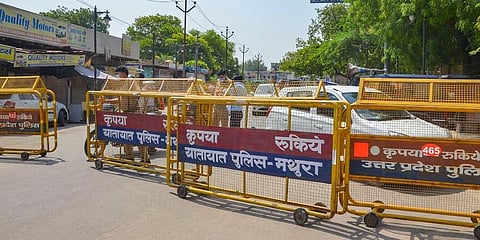 UP Police barricades put on a road to block the movement of people towards Hathras and Aligarh districts. (File Photo | PTI)