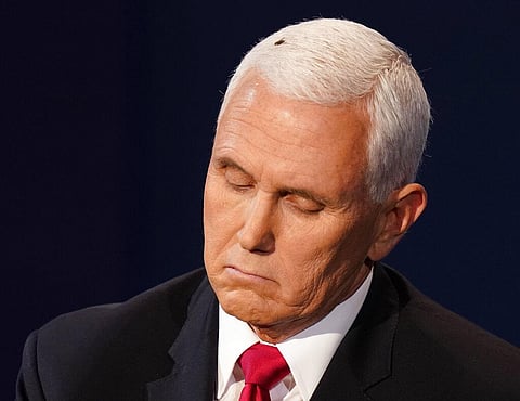 Vice President Mike Pence listens to Democratic vice presidential candidate Sen. Kamala Harris, D-Calif., during the vice presidential debate. (Photo | AP)