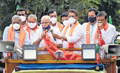 Chief Minsiter BS Yediurappa campaigns for BJP candidate from RR Nagar Muniratna, along with ministers R Ashok, ST Somashekhar and Byrathi Basavaraj, in Bengaluru on Saturday | Express