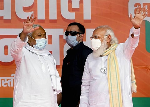 PM Narendra Modi and Bihar Chief Minister Nitish Kumar wave at the crowd during an election rally for the second phase of Bihar Assembly polls in Samastipur. (File Photo | PTI)