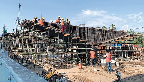 Workers engaged in reconstruction of pier caps of Palarivattom flyover. Along with Pier caps, girders and deck slabs are also being built as part of the reconstruction | Albin Mathew