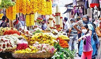 People shop at Gandhi Bazaar in Bengaluru | Express