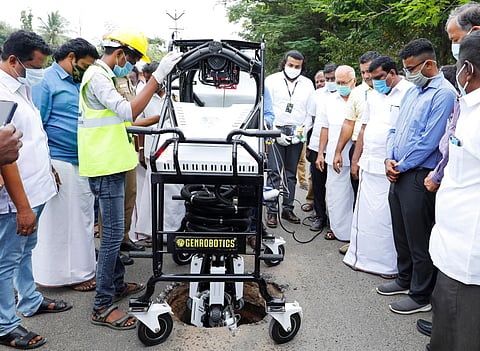 Staff from Genrobotic Innovations Private Limited demonstrating the application of Bandicoot, the manhole-cleaning robotic scavenger in Nagapattinam (Photo | Express)