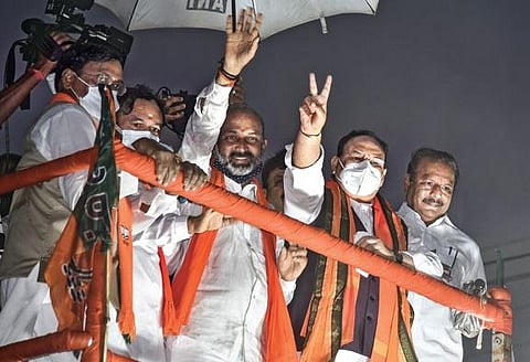 BJP national president J P Nadda, party’s State unit chief Bandi Sanjay Kumar and Union Minister of State for Home Affairs G Kishan Reddy during a roadshow in Hyderabad. (Photo| EPS/VINAY MADAPU)