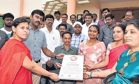 Snehita Amrutha Hastam president Memmela Raju receiving appreciation for his work I Express