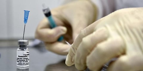 A nurse prepares to inoculate a volunteer with Russia's Sputnik-V COVID vaccine at a clinic in Moscow. (File photo| AFP)