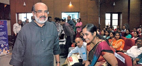 Finance Minister T M Thomas Isaac walks to the dais to address the KSFE's meeting at the Town Hall, Ernakulam. (File Photo | K Shijith, EPS)