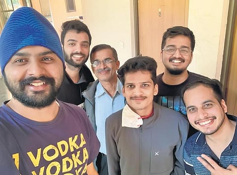 Vasudev with his father and close friends, who, he says, all believed in him