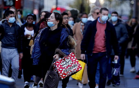Shoppers walk along a very busy Regent Street in London. (Photo | AP)