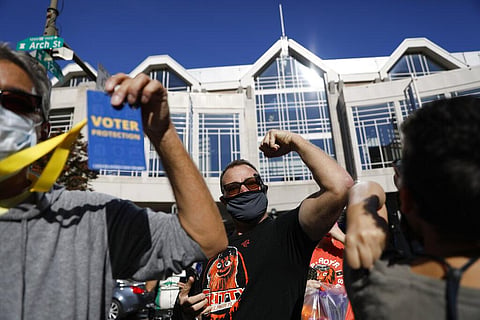 People celebrate outside the Pennsylvania Convention Center after Democrat Joe Biden defeated President Donald Trump. (Photo | AP)