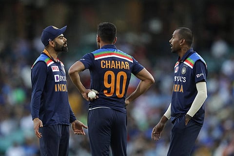 India's captain Virat Kohli, left, Deepak Chahar, center, and Hardik Pandya interact during the third T20 between Australia and India at the SCG in Sydney, Tuesday, Dec. 8, 2020. (Photo | AP)