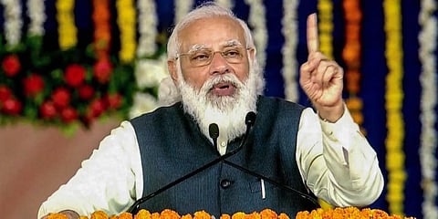 Prime Minister Narendra Modi addresses at the foundation stone laying ceremony of development projects in Kutch Tuesday. (Photo | PTI)