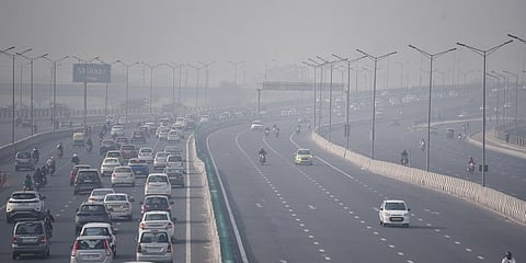 Vehicles seen moving through thick smog as the air quality deteriorates with the rise of pollutants in the atmosphere, in New Delhi. (File Photo| ANI)