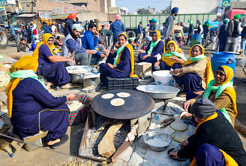 Farmers prepare 'langar' for fellow farmers during their protest against the new farm laws. (Photo| PTI)
