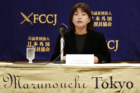 Shoko Arai, a former councilwoman in Kusatsu town, northwest of Tokyo, speaks during a news conference. (Photo| AP)