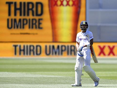 Skipper Virat Kohli seen walking away after he was caught for four runs against Australia on the third day of the Adelaide Test. (Photo | AP)