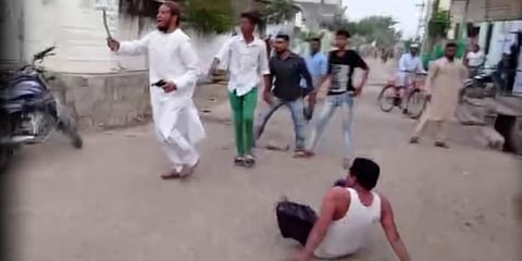 AIMIM leader Farooq Ahmed points his gun at rivals, who suffered injuries in the shooting in Adilabad town on Friday. (Photo| Special Arrangement)
