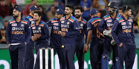 India's Virat Kohli (L) gathers with teammates following the dismissal of Australia's Aaron Finch for 75 runs during the ODI match at Manuka Oval in Canberra. (Photo | AP)