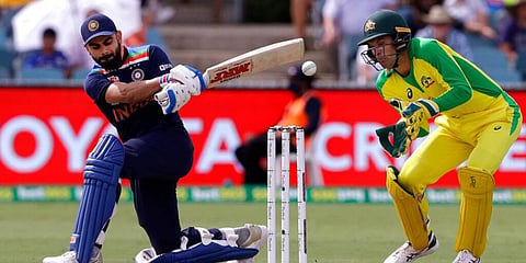 India's Virat Kohli goes to one knee to play a shot against Australia at Manuka Oval in Canberra. (Photo | AP)