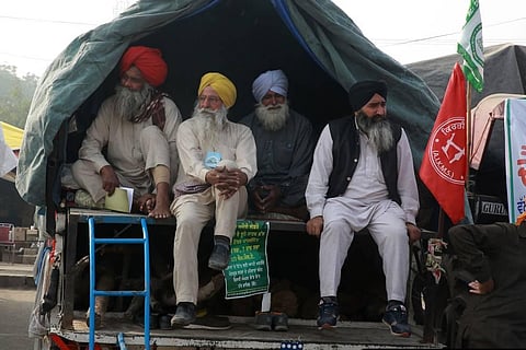 Farmers during the ongoing protest against the farm laws at Singhu Border in New Delhi on Tuesday. (Photo | Shekhar Yadav/EPS)