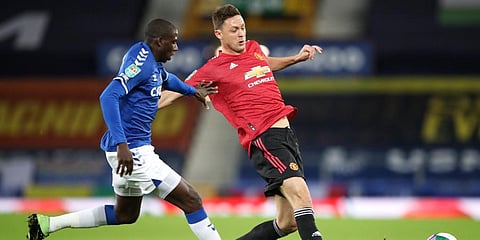 Manchester United's Nemanja Matic and Everton's Abdoulaye Doucoure (L) contest for the ball during the English League Cup quarterfinal match at Goodison Park, Liverpool. (Photo | AP)