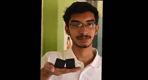 S Riyasdeen, SASTRA student with the two lightest satellites designed by him and to be launched by NASA. (Special arrangement)