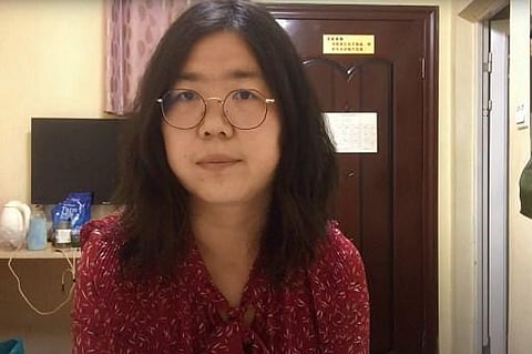 Former Chinese lawyer and citizen journalist Zhang Zhan broadcasts via YouTube, at an unconfirmed location in China. (Photo | AFP)
