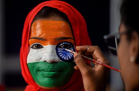 A student gets her face painted during Republic Day celebrations. (Photo | PTI)