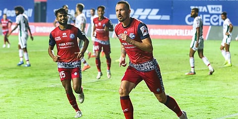 Nerijus Valskis (R) of Jamshedpur FC celebrates his goal during a match of the ISLÂ against ATK Mohun Bagan at the Tilak Maidan Stadium in Goa. (Photo | PTI)