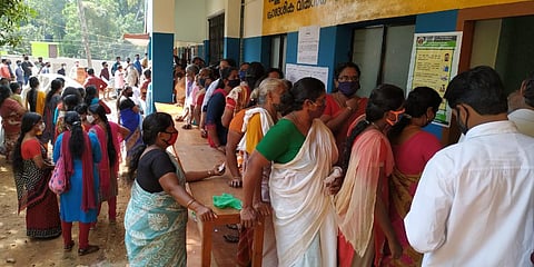 People waiting without social distancing to cast votes at Government HSS Azhoor in Thiruvananthapuram. (Photo| BP Deepu, EPS)