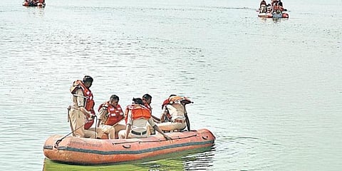 A team of NDRF personnel search for Sachin Machaiah’s body in Kalkere Lake, in Bengaluru on Sunday. (Photo | Meghana Sastry, EPS)