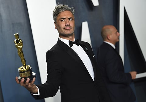 Taika Waititi, winner of the award for best adapted screenplay for 'Jojo Rabbit,' arrives at the Vanity Fair Oscar Party. (Photo | AP)
