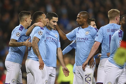 Manchester City players celebrate a goal during a league match. (Photo | AP)