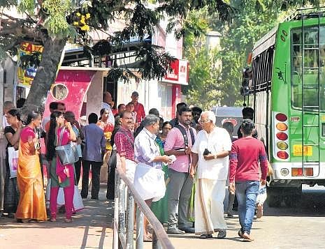 The Palayam bus stop opposite St Joseph’s Cathedral is congested and does not have the capacity to accommodate many people. People wait on the road to catch buses B P Deepu