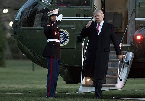 President Donald Trump salutes as he disembarks Marine One upon arrival at the White House, Sunday, March 5, 2017. (File | AP)