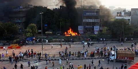 Thick smoke billowed in the air and mobs roamed unchecked through the streets, pelting stones, vandalising shops and threatening locals, as fresh violence broke out in northeast Delhi on Tuesday, a day after seven people were killed in communal clashes ov